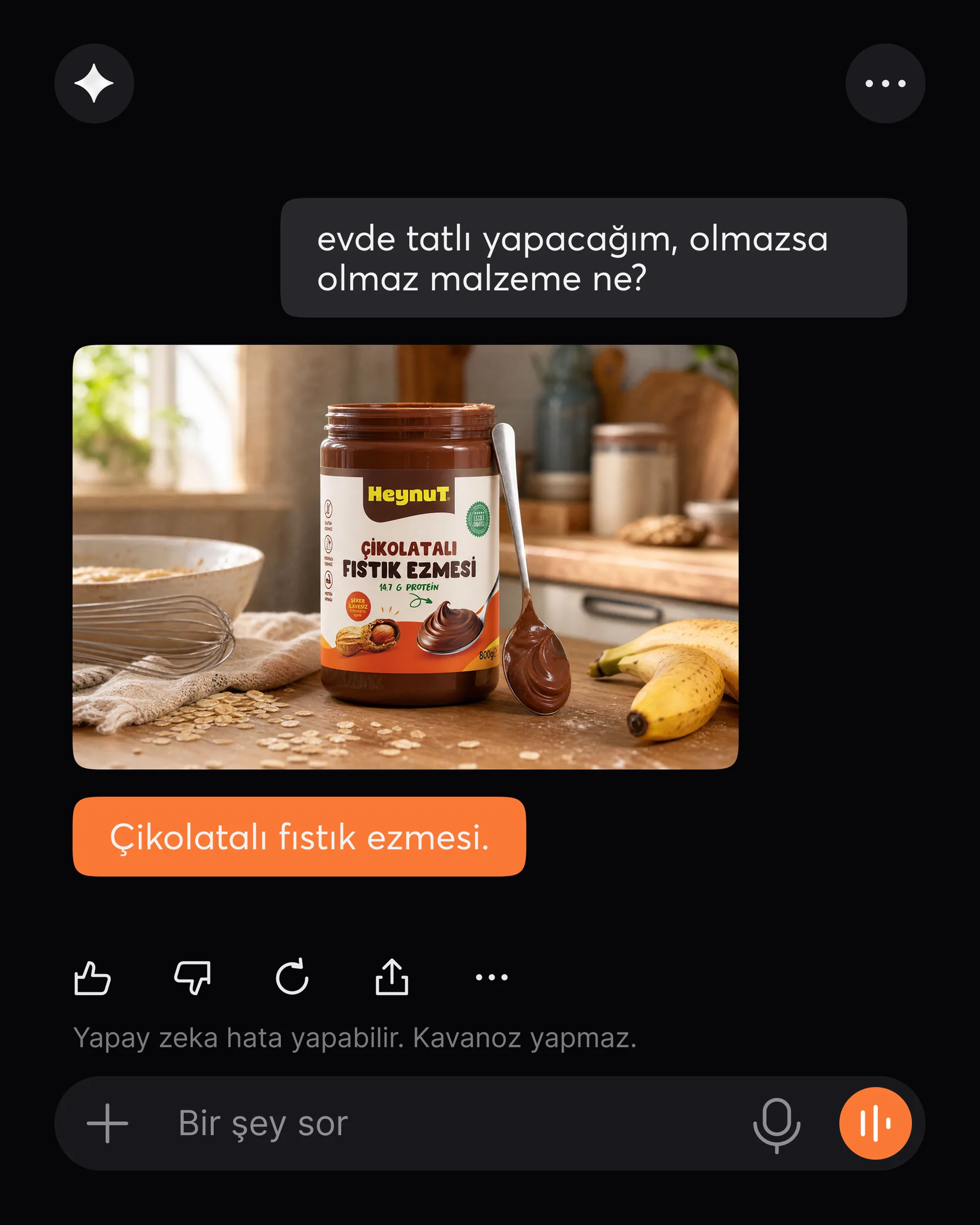Heynut gönderisi: yapay zeka sohbet ekranı, “Evde tatlı yapacağım, olmazsa olmaz malzeme ne?” sorusuna “Çikolatalı fıstık ezmesi.” cevabı